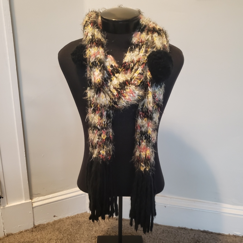 Fuzzy striped scarf with pom poms